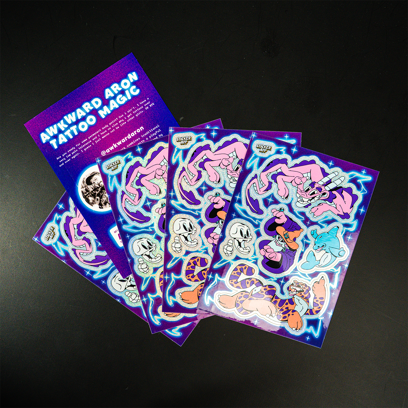Thank You card sticker sheets with cartoon characters of different animals and flashes, and the text "AWKWARD ARON TATTOO MAGIC".