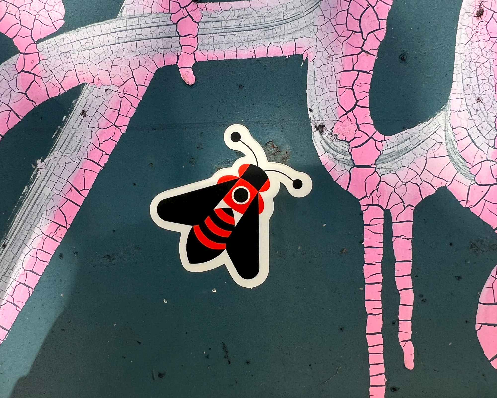 Moth die-cut sticker on rugged texture