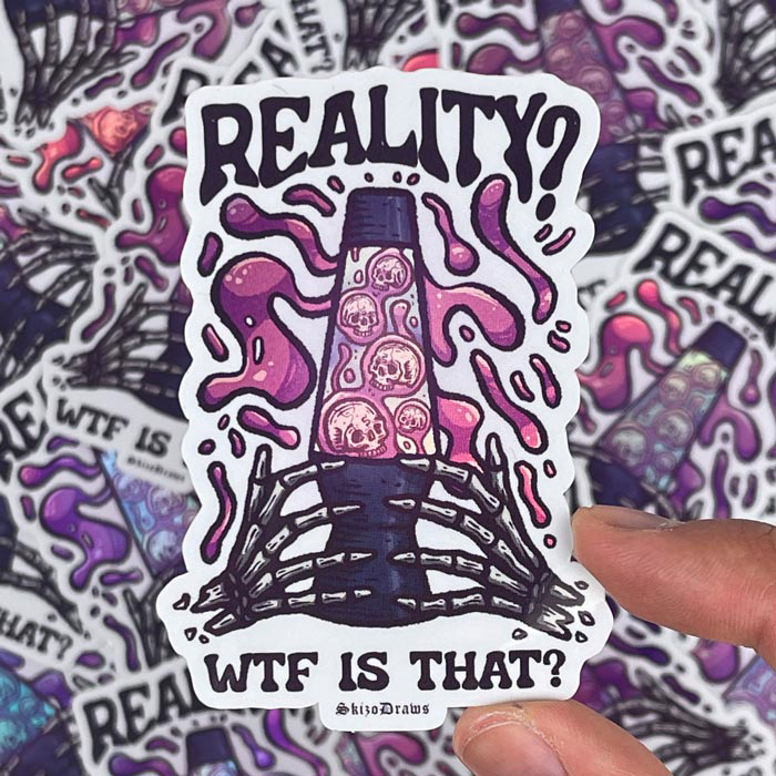 Muotoon leikattu vinyylitarra, jossa luurangon kädet pitelevät laavalamppua, ympärillä leijuu pääkalloja ja tekstinä on "REALITY? WFT IS THAT?". Taustalla tarroja.